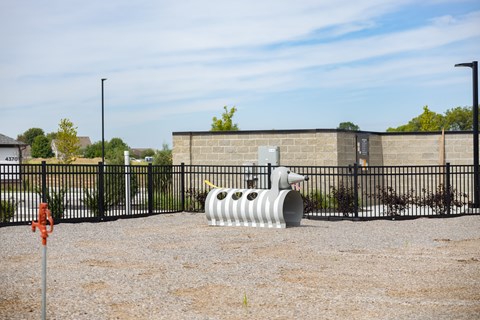 Fenced pet park with dog agility equipment at Montage West Lafayette apartments in West Lafayette, IN.