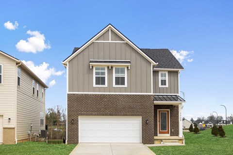 Rental home with attached two-car garage and driveway at Mural Lewis Center