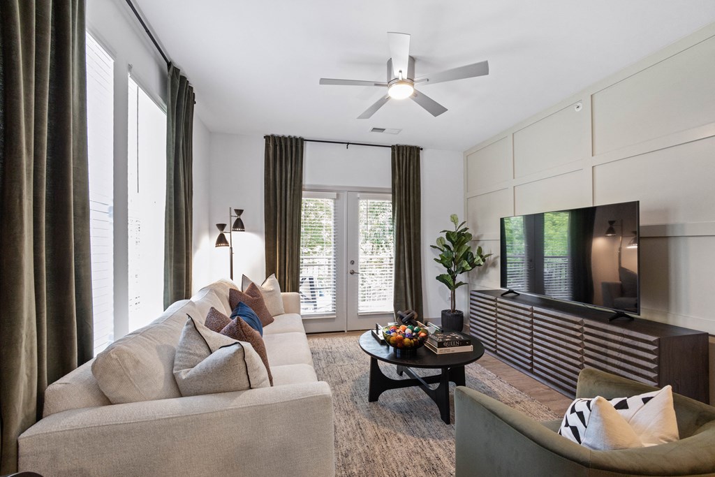 a living room with a couch and a tv