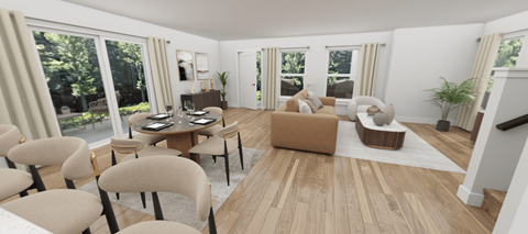 A living room with a dining table and chairs.