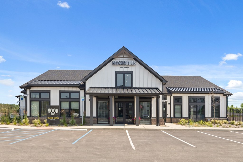A building with a sign that says "NOOK" is in front of a blue sky.