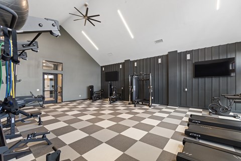 Fitness center with treadmills at Montage West Lafayette Apartments, West Lafayette, Indiana