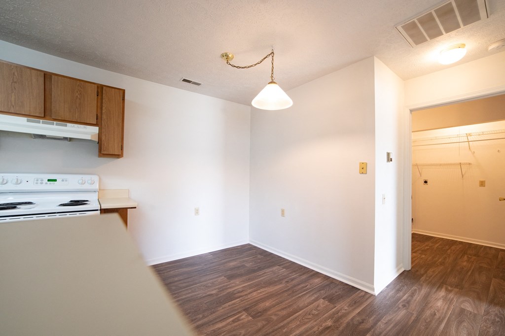 a kitchen and dining area in a 555 waverly unit