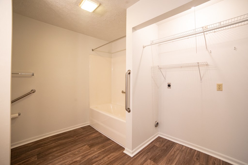 a bathroom with a shower and a bathtub