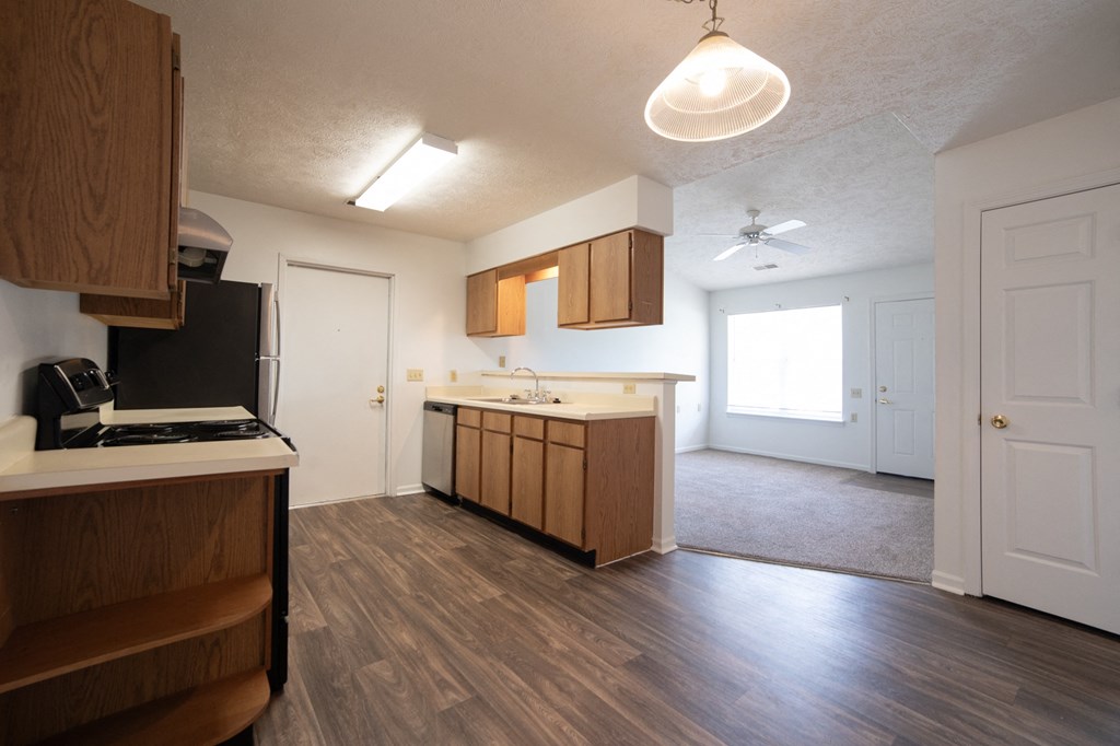 a kitchen and living room in a 555 waverly unit