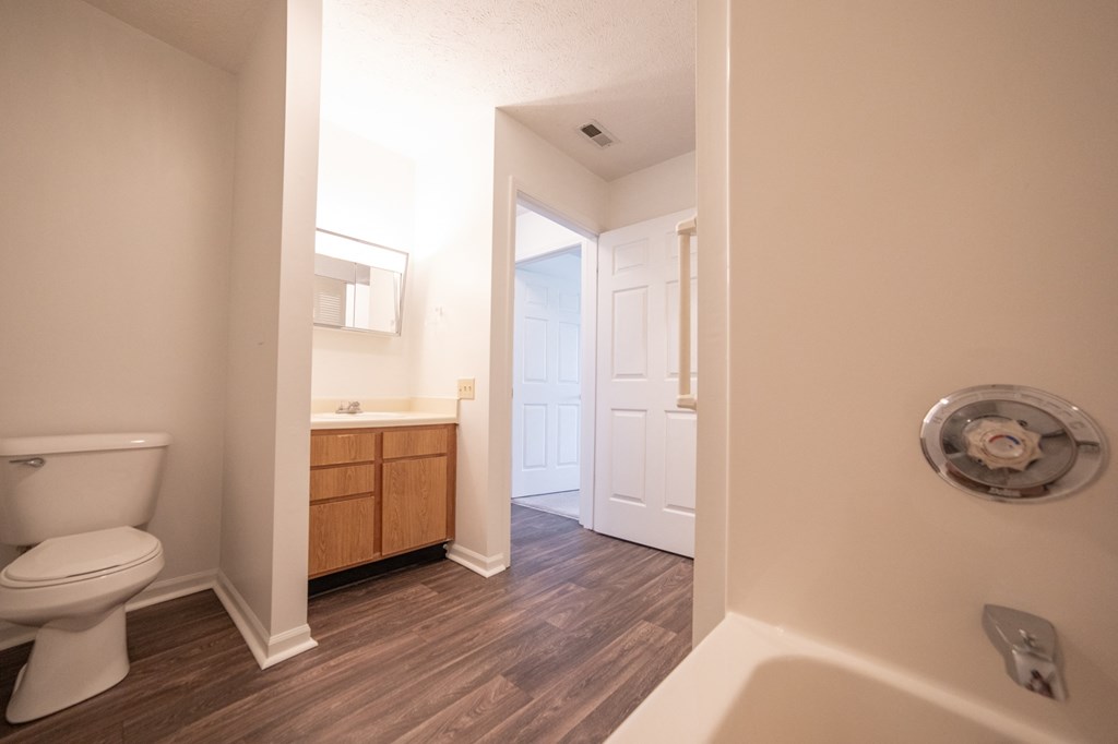 a bathroom with a toilet sink and bathtub