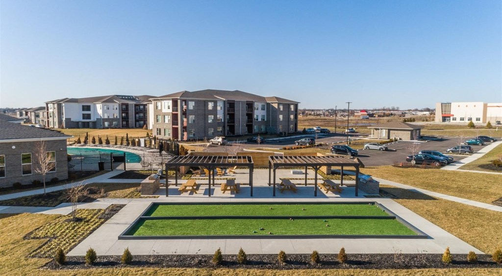 an aerial view of an apartment complex with a pool and grass at Echo Park at Perry Crossing Apartments, Plainfield, IN