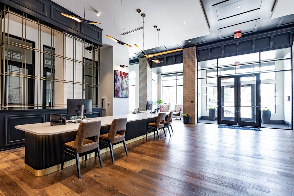 a large open space with a long desk and chairs