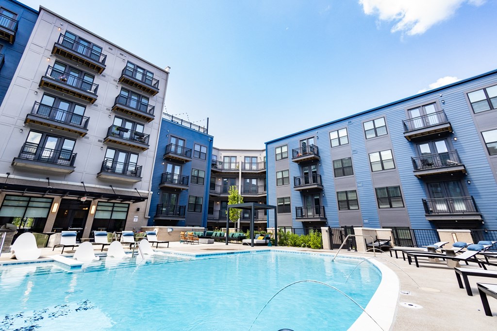 a swimming pool in the middle of some buildings