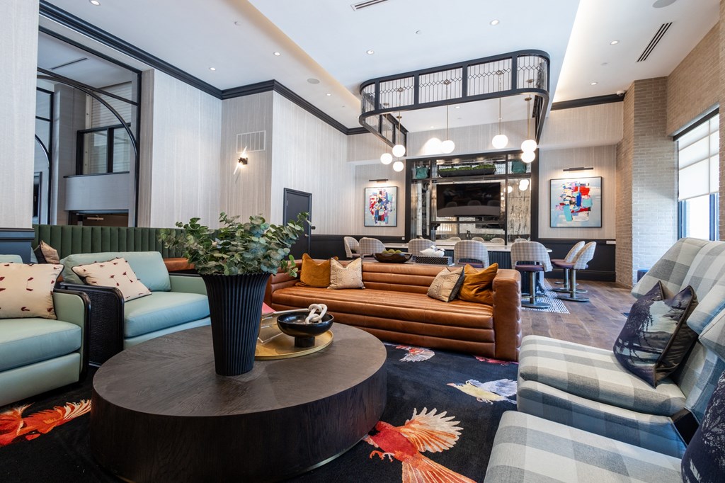 a living room filled with furniture and a large window