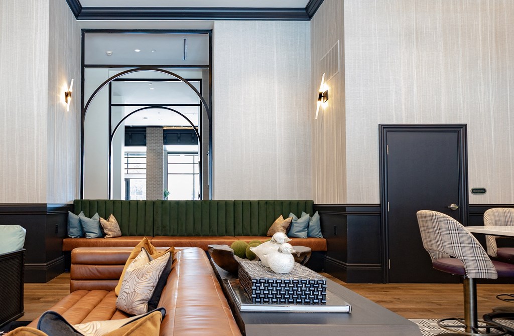 a living room filled with furniture and a large window