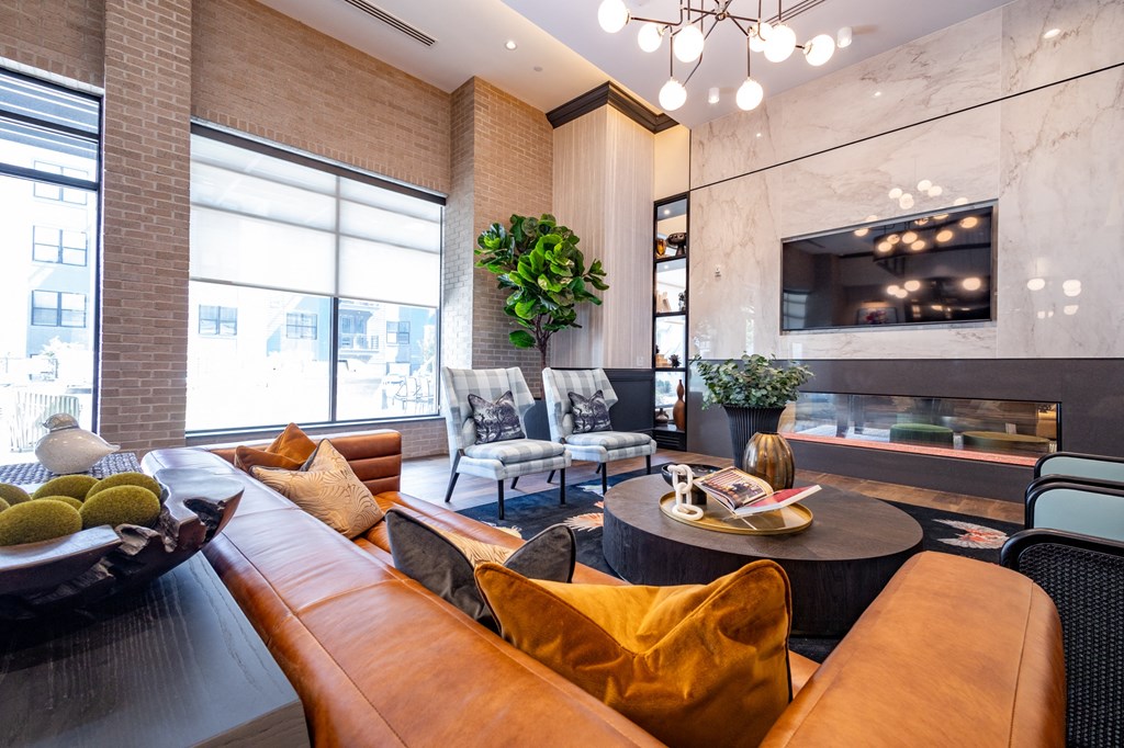 a living room filled with furniture and a large window