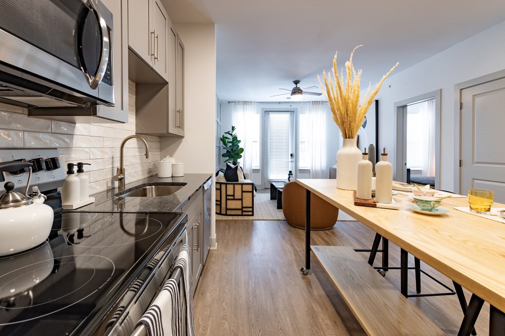 a kitchen and dining area in a 555 waverly unit