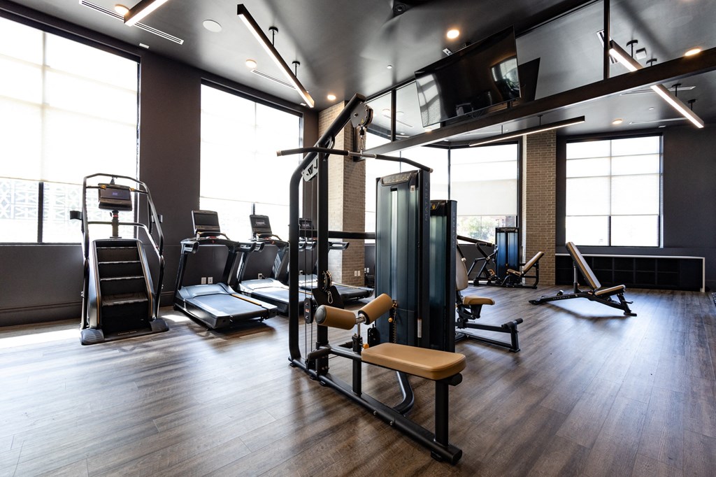 a gym with a lot of exercise equipment