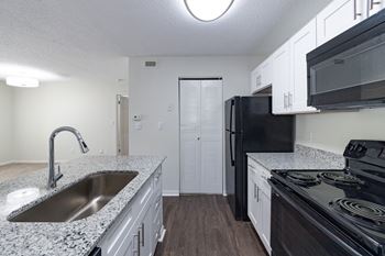 Stainless Steel Sink With Faucet In Kitchen at The Residence at White River Apartments, Indianapolis