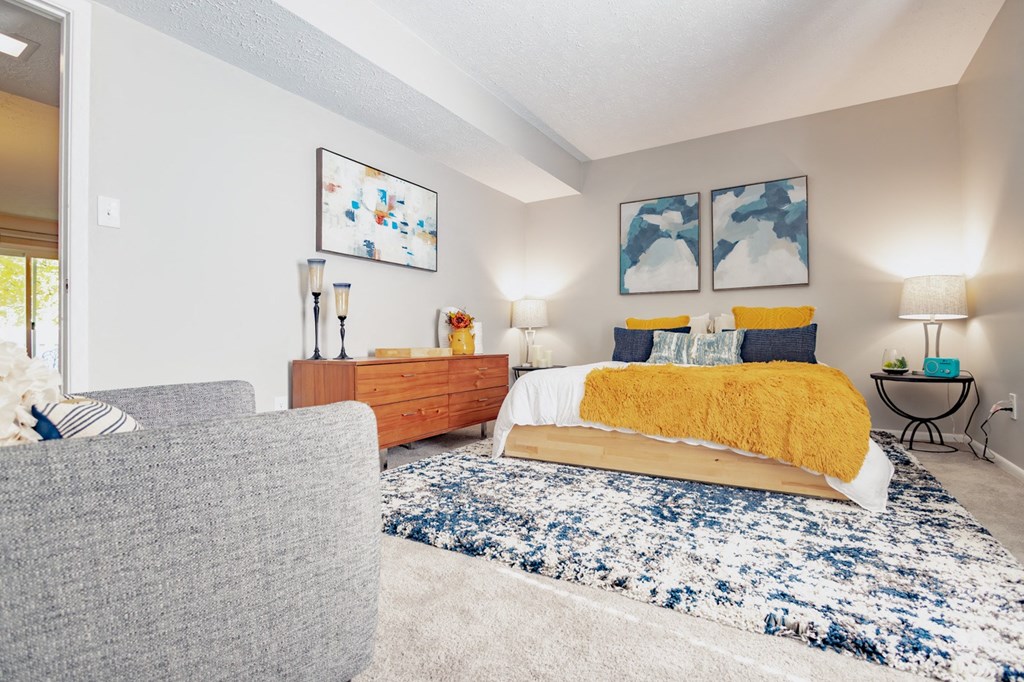 a living room with a bed and a couch