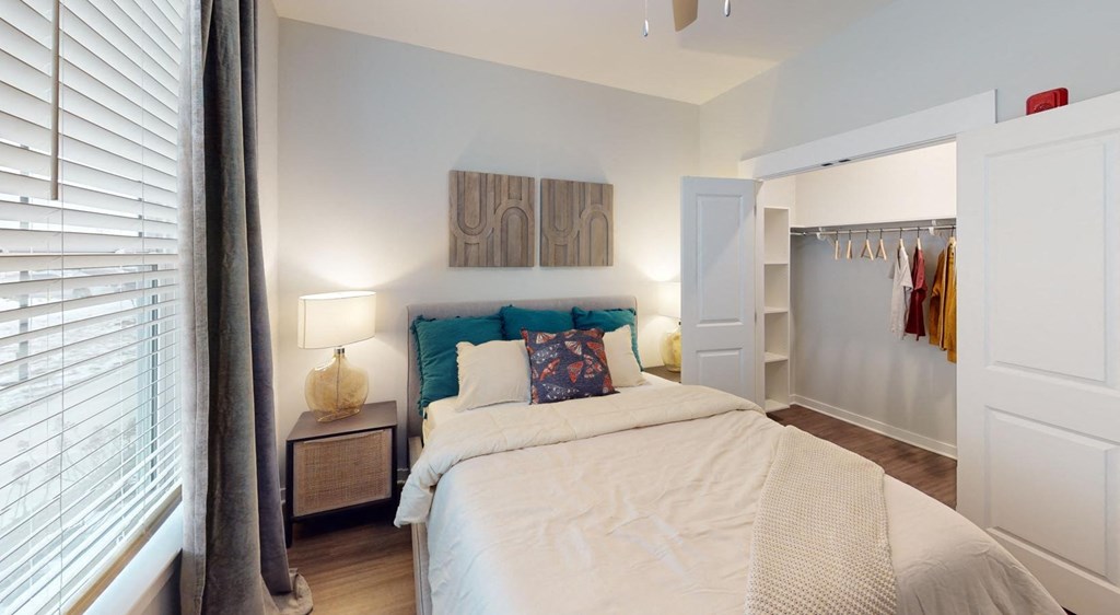 a bedroom with a bed and a closet