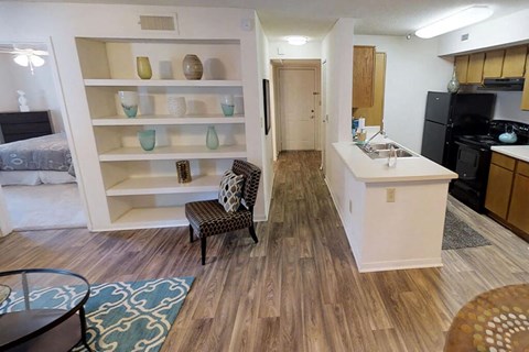 a kitchen and living room with an open floor plan