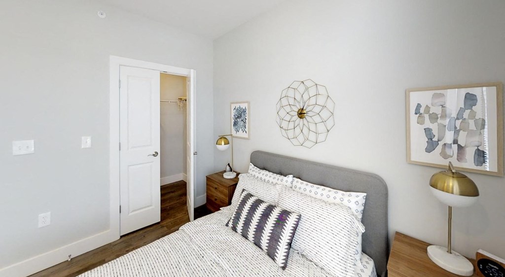 bedroom with white bedding at Echo Park at Perry Crossing Apartments, Plainfield, 46168