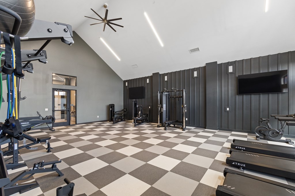 Modern fitness center at Nook Nine with top-tier cardio, strength equipment, and sleek design.