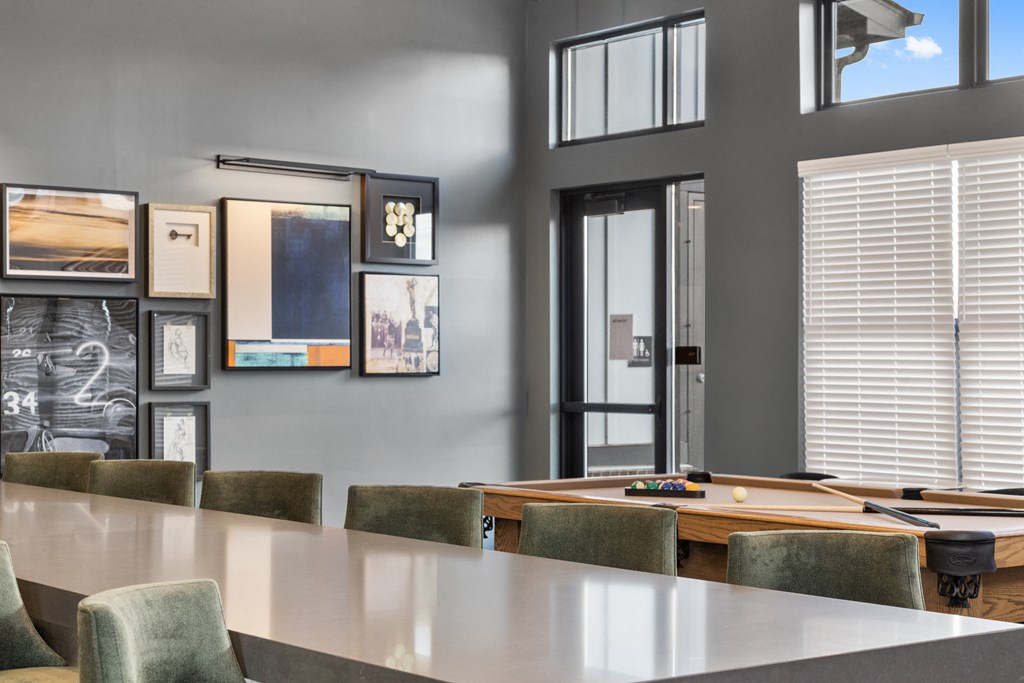 Clubhouse at Nook Nine with a billiards table, modern artwork, and a sleek communal table.