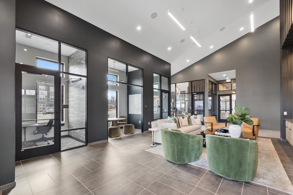 Modern clubhouse at Nook Nine with stylish lounge seating, private workspaces, and high ceilings.