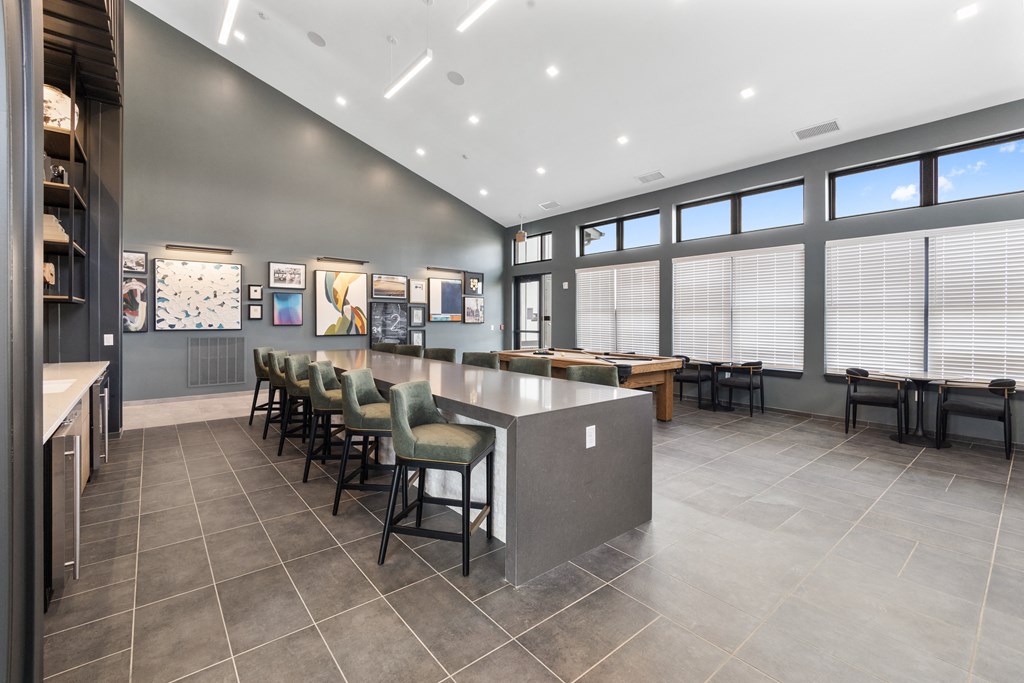 Stylish clubhouse at Nook Nine with modern seating, high ceilings, and vibrant artwork.