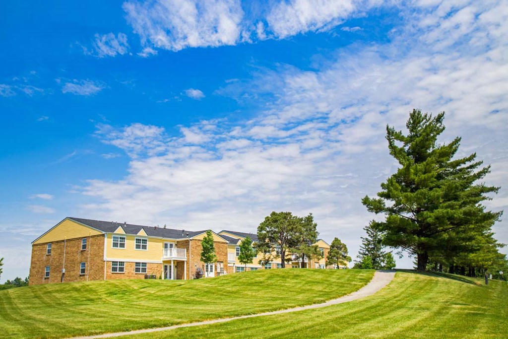 a house on a hill with a path leading up to it