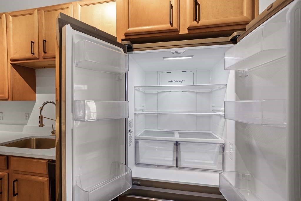 A white refrigerator with its door open in a kitchen.at The Foundry, Indiana