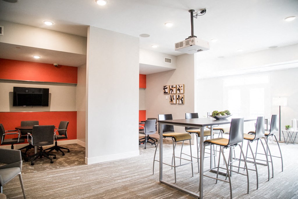a conference room with a table and chairs and a tv at The Foundry, South Bend, IN 46617