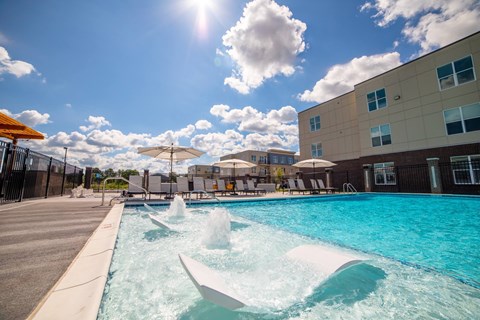 a swimming pool at a hotel with a blue sky at The Century at Purdue Research Park-Student, West Lafayette, IN 47906