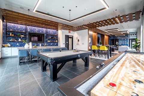 a game room with a pool table and a bar at The Century at Purdue Research Park-Student, Indiana, 47906