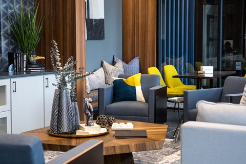 a living room with couches and chairs and a coffee tableat The Century at Purdue Research Park-Student, West Lafayette