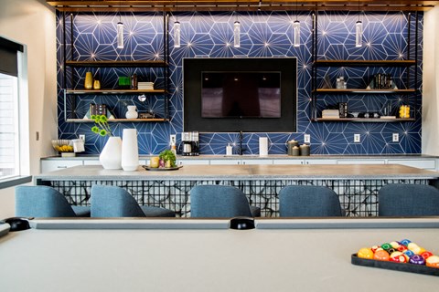 a conference room with a pool table and a television at The Century at Purdue Research Park-Student, West Lafayette
