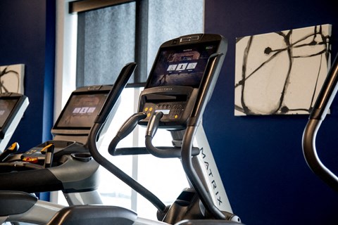 a row of treadmills in a gym at The Century at Purdue Research Park-Student, West Lafayette