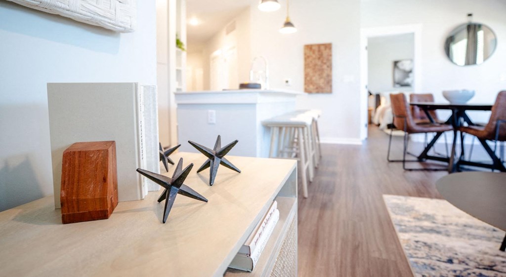 a living room with a table with three stars on it