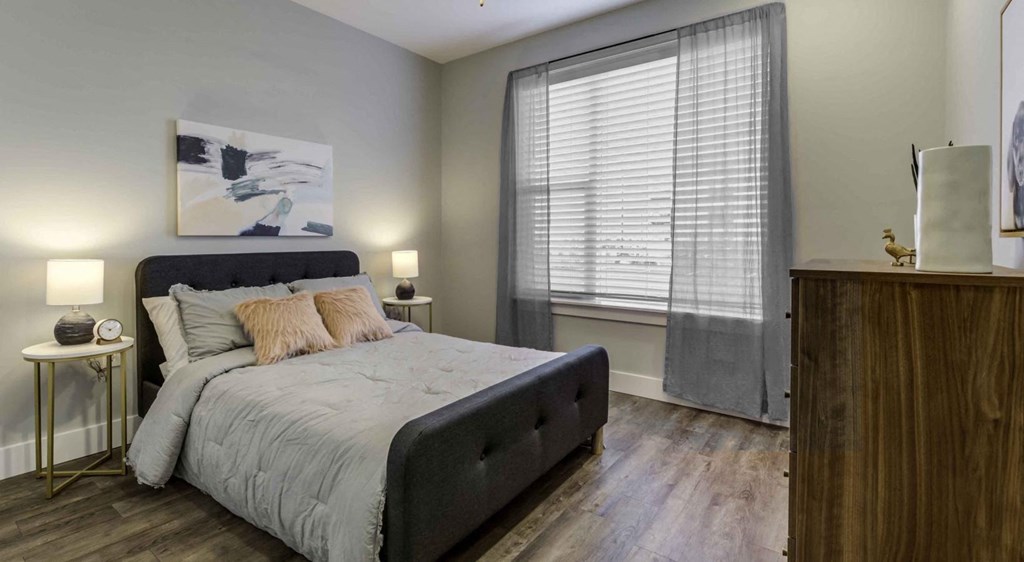 a bedroom with a bed and a large window a bedroom with a bed and a large window at Echo Park at Perry Crossing Apartments, Plainfield, Indiana