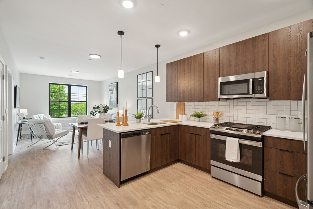 an open kitchen and dining room with a table and chairs