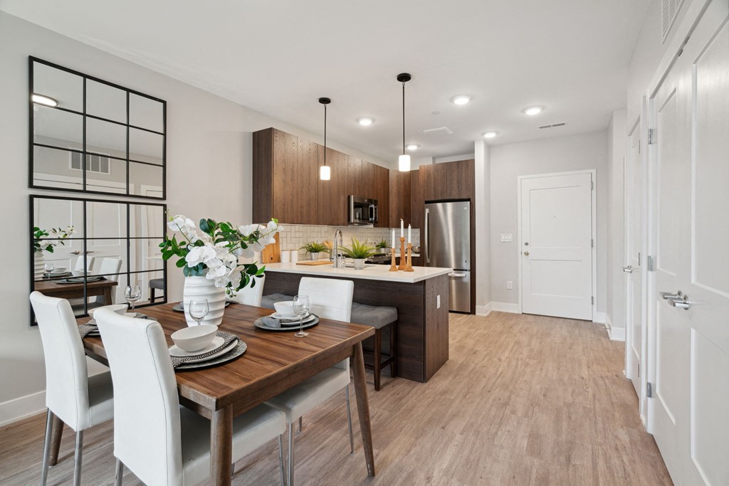 a dining room and kitchen in a model home