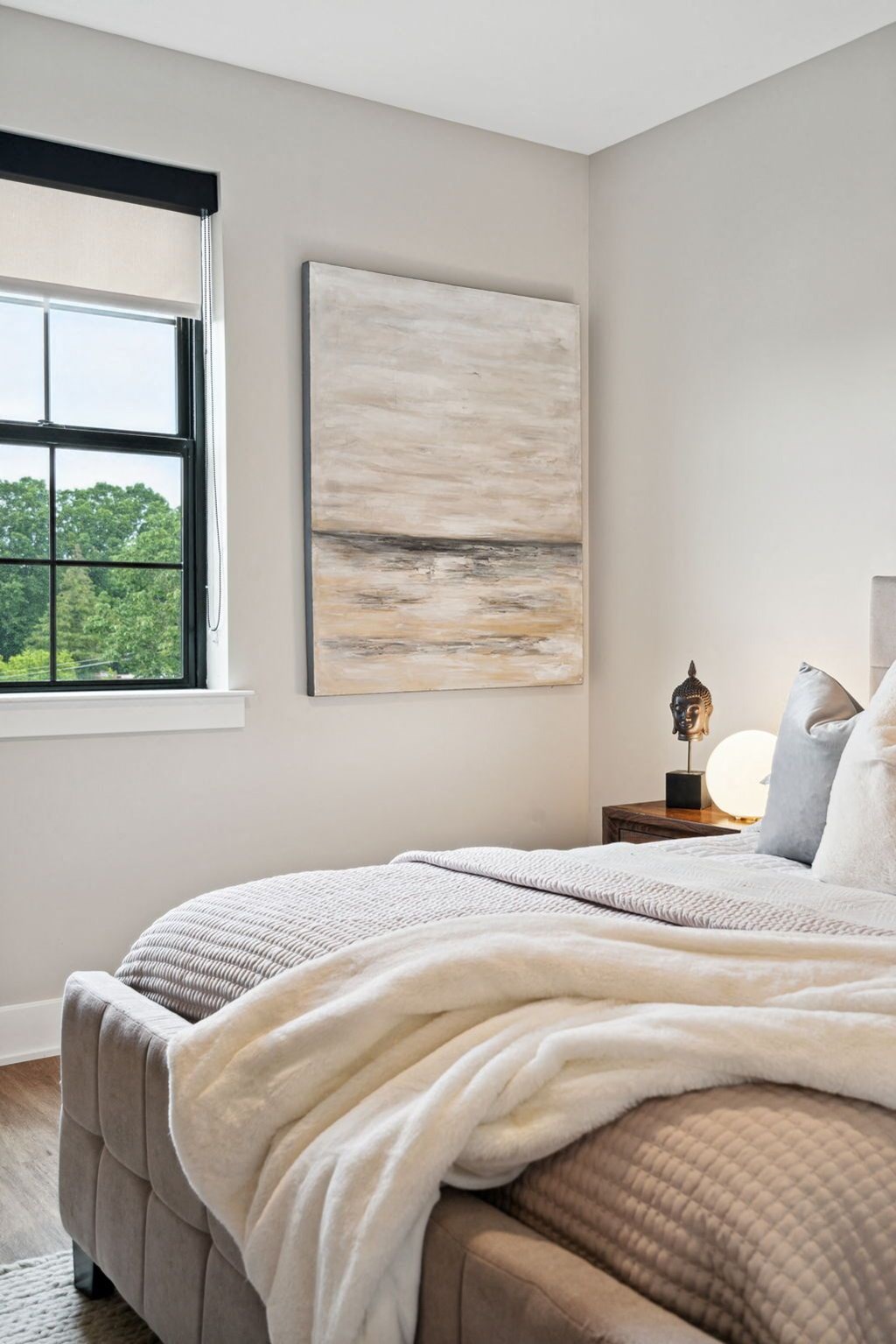 a bedroom with a bed and a window