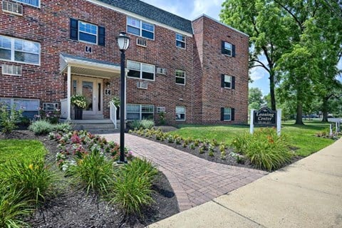 A brick building with a sign that says "Centre" in front of it.