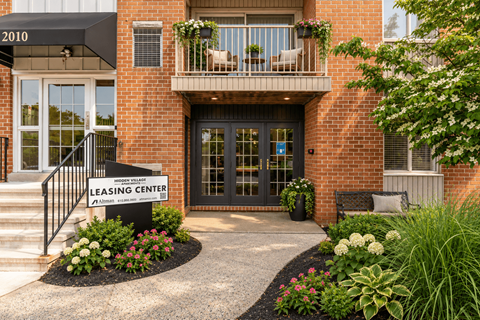 A brick building with a sign that says Leasing Center.