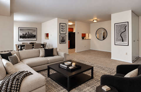 A living room with a couch, chair, and coffee table.