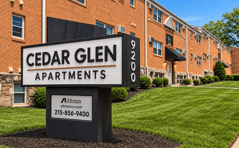 A sign for Cedar Glen Apartments with a phone number for Altiman.