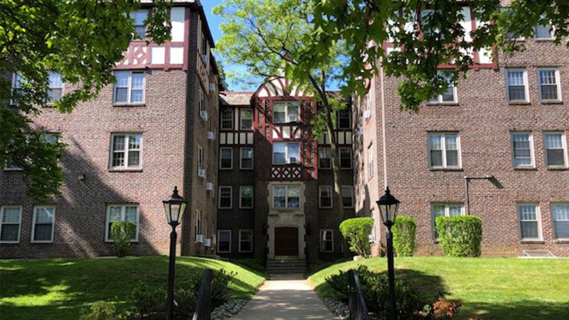 A large brick building with a gothic style entrance.