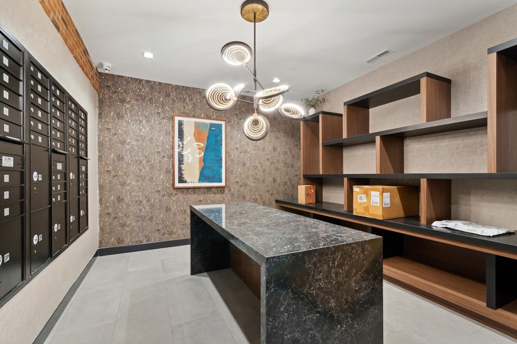 a kitchen with a marble counter top and wooden cabinets