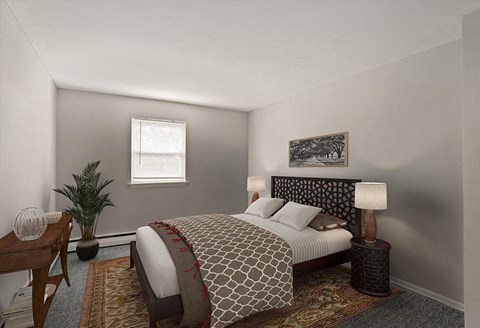 A bedroom with a bed, nightstand, and a potted plant.