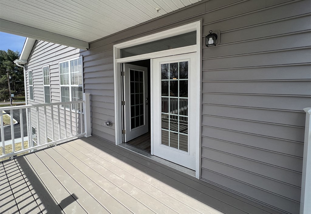 the door to the deck is open to the yard