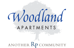 Woodland Apartments logo