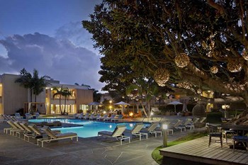 pool with lounge chairs l Coronado on the Bay Apartments in Coronado CA - Photo Gallery 3